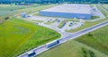 Aerial view of goods warehouse. Logistics center in industrial city zone from above. Aerial view of trucks loading at logistic Royalty Free Stock Photo