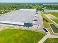 Aerial view of goods warehouse. Logistics center in industrial city zone from above. Aerial view of trucks loading at logistic Royalty Free Stock Photo