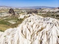 Aerial view of Goreme National Park, Tarihi Milli Parki, Turkey. The typical rock formations of Cappadocia. Tourists on quads Royalty Free Stock Photo