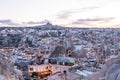 Aerial view of Goreme town with cave hotel built in rock formation in national park Goreme under sunset ,Cappadocia, Turkey