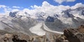 Aerial view of Gorner Glacier and Monte Rosa summit in Switzerland with a rocky ridge on the foreground Royalty Free Stock Photo