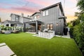 a large house that has grass and lawn furniture on the grass