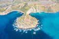 Aerial view from a great height of the coastlinescenic sliffs near the mediterranean turquoise water sea. Gnejna and Ghajn