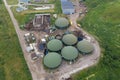 Aerial view of green biogas plant storage tanks