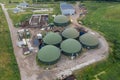 Aerial view of green biogas plant storage tanks