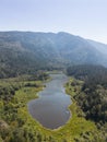 Aerial View of Green Canadian Nature Landscape. Lake around Mountains. Royalty Free Stock Photo