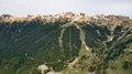 Aerial view of green Cerro Cathedral, a famous ski resort during summer time with its peaks covered in snow Royalty Free Stock Photo