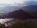 Aerial view of the green fertile fields of crops and corn fields on background of hills. Indonesia, Bali Royalty Free Stock Photo