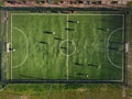 Football field with unknown players playing the game Royalty Free Stock Photo