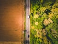 Aerial view of green forest asphalt road. Aerial view car truck drive going through forest. Royalty Free Stock Photo