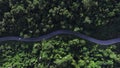 Aerial view green forest and asphalt road, Top view forest road going through forest with car adventure