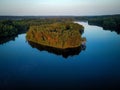 Aerial view of a green forest on an isle in a lake in Bruggen, Germany at sunrise Royalty Free Stock Photo