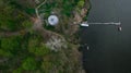 Aerial view of green forest and river with a fishing boat Royalty Free Stock Photo