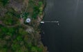 Aerial view of green forest and river with a fishing boat Royalty Free Stock Photo