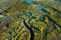 Aerial View Green Forest Woods And River Landscape In Sunny Spring Summer Day. Top View Of Nature, Bird's Eye View Royalty Free Stock Photo