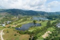 Aerial view of the green golf course in Thailand Beautiful green grass and trees on a golf field with fairway and putting green in Royalty Free Stock Photo