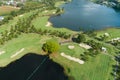 Aerial view of the green golf course in Thailand Beautiful green grass and trees on a golf field with fairway and putting green in Royalty Free Stock Photo