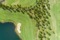 Aerial view of the green golf course in Thailand Beautiful green grass and trees on a golf field with fairway and putting green in Royalty Free Stock Photo