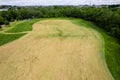 Aerial view on a green grass field with freshly cut field with strange shapes. Nature background. Design in forest park Royalty Free Stock Photo