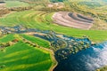 Aerial View Green meadows And River Landscape In Sunny Spring Summer Day. Top View Of Nature, Bird's Eye View. Trees Royalty Free Stock Photo