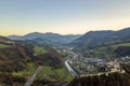 Aerial view of green meadows with villages and forest in austrian Alps mountains Royalty Free Stock Photo