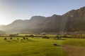 Aerial view of green meadows with villages and forest in austrian Alps mountains Royalty Free Stock Photo