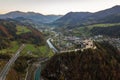 Aerial view of green meadows with villages and forest in austrian Alps mountains Royalty Free Stock Photo