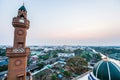 Aerial view of green mosque dome and green roof against at dusk, scenic landscape of canal side and urban of Bangkok, Thailand