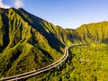 Aerial view of green mountain cliffs and the famous Haiku Stairs in Oahu, Hawaii