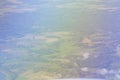 Aerial view of green and yellow fields, forests, nature and some small white clouds. View from an airplane window of rural Royalty Free Stock Photo