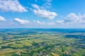 Aerial view on green and yellow parts of fields and countryside