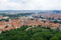 Aerial view of the greenery of Perin Hill and the city of Prague.