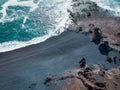 aerial view of grey sandy seashore with rocks and waves djpalnssandur