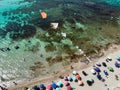 Aerial View of a Group of Kites on Italian Beach in Summer in a Sunny Day on Beach Umbrellas Background Royalty Free Stock Photo