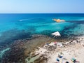 Aerial View of a Group of Kites on Italian Beach in Summer in a Sunny Day on Beach Umbrellas Background Royalty Free Stock Photo