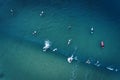 Aerial view of a group of surfers in the ocean at the Baleal beach in Peniche Royalty Free Stock Photo