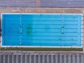 Aerial top view of group of swimmers training in swimming pool. Many sportive people swim in Open Water Swimming pool
