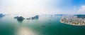 Aerial view of Ha Long Bay and Halong City skyline, unique limestone rock islands and karst formation peaks in the sea, famous