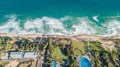 Aerial view of Haitang Bay beach, coastline with beach chairs, umbrellas, palm trees. luxury Tropical beach with the background of Royalty Free Stock Photo