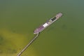 Aerial view of a half-sunken rusty barge at the last berth on the Ob River in Siberia, Russia, in summer