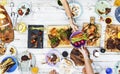 Aerial view of hands sharing food together