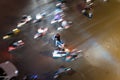 Aerial view of Hanoi traffic with immobile motorcycle and other blurred vehicles running around. Messy traffic at rush hour.