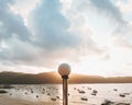 Aerial view of a harbor filled with boats sailing near the shore at sunset Royalty Free Stock Photo