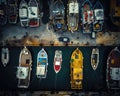 Aerial view of harbor filled with Fishing trawlers, vessels and boats at dawn, morning activity just beginning. A day in the hard