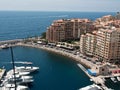 Aerial View Of The Harbor Of Fontvieille With Coastline Buildings And Parked Boats, Monaco