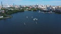 Aerial view of harbor with white beautiful sailing boats in the city pond. Video. Small yachts sailing near the pier on