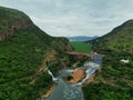 Aerial view of the Hartbeespoort Dam wall in South Africa, with lush greenery in the foreground Royalty Free Stock Photo