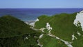 Aerial view of the Hawaiian coastline near blue sea. Clip. Paradise island covered by green vegetation. Royalty Free Stock Photo