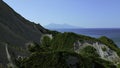 Aerial view of the Hawaiian coastline near blue sea. Clip. Paradise island covered by green vegetation. Royalty Free Stock Photo