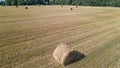 Aerial view of hay bales on the field after harvest. Landscape of straw bales on agricultural field. Countryside landscape Royalty Free Stock Photo
